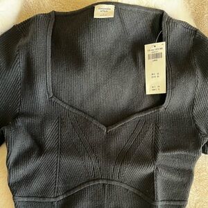 Abercrombie & Fitch black corset-inspired ribbed bodysuit.